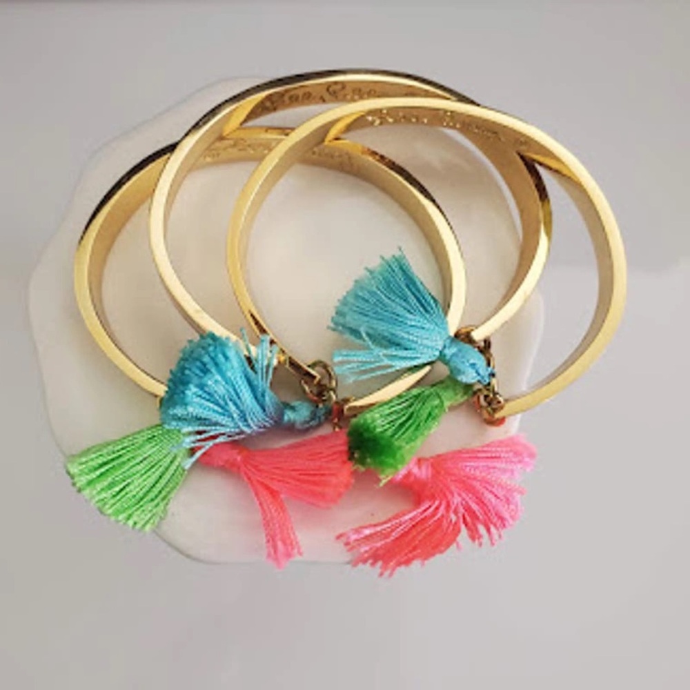Set of 3 authentic Lily Pulitzer gold-toned tassel bangles with summer sayings!